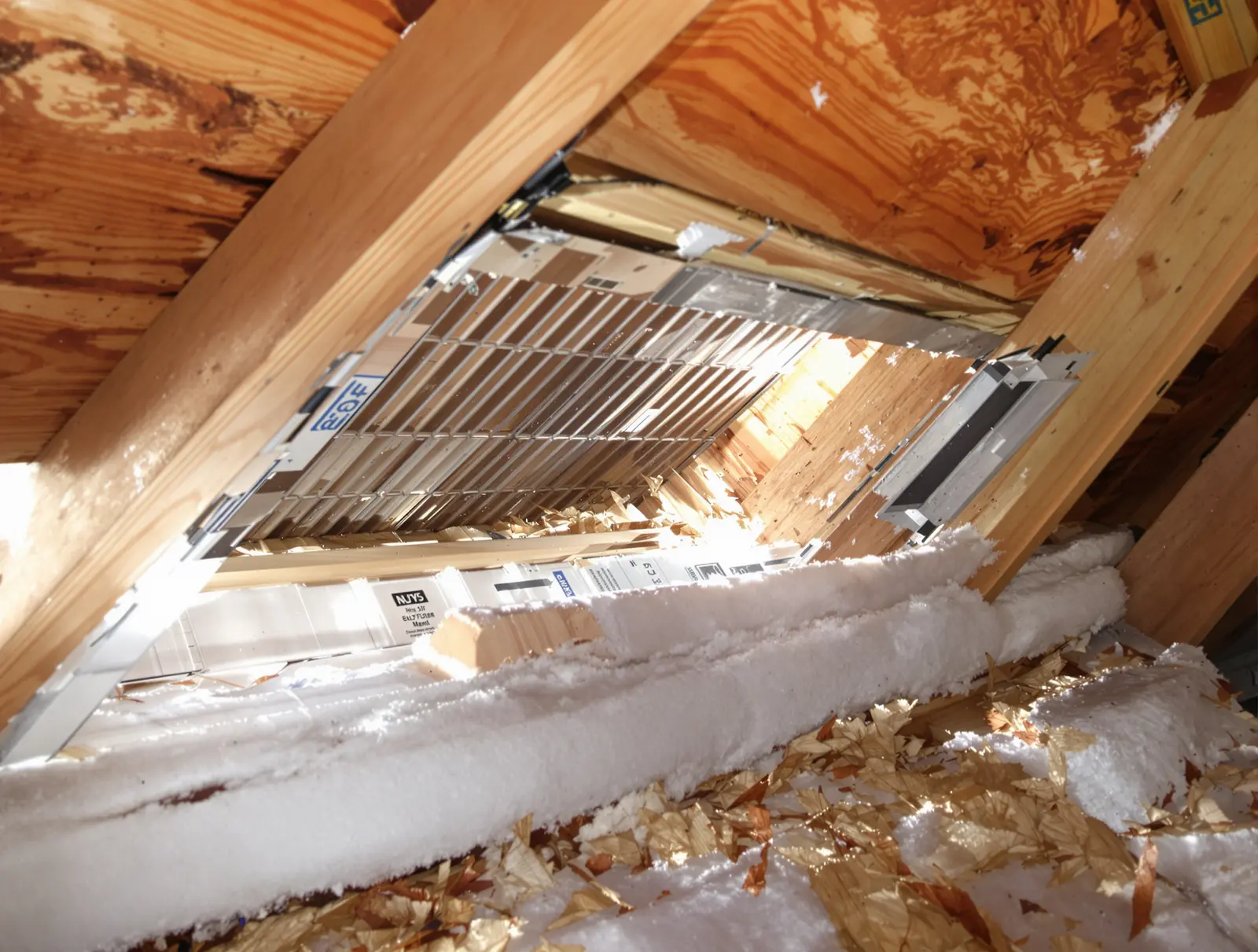 Properly installed rafter baffles maintaining a clear air channel from soffit vent into the attic