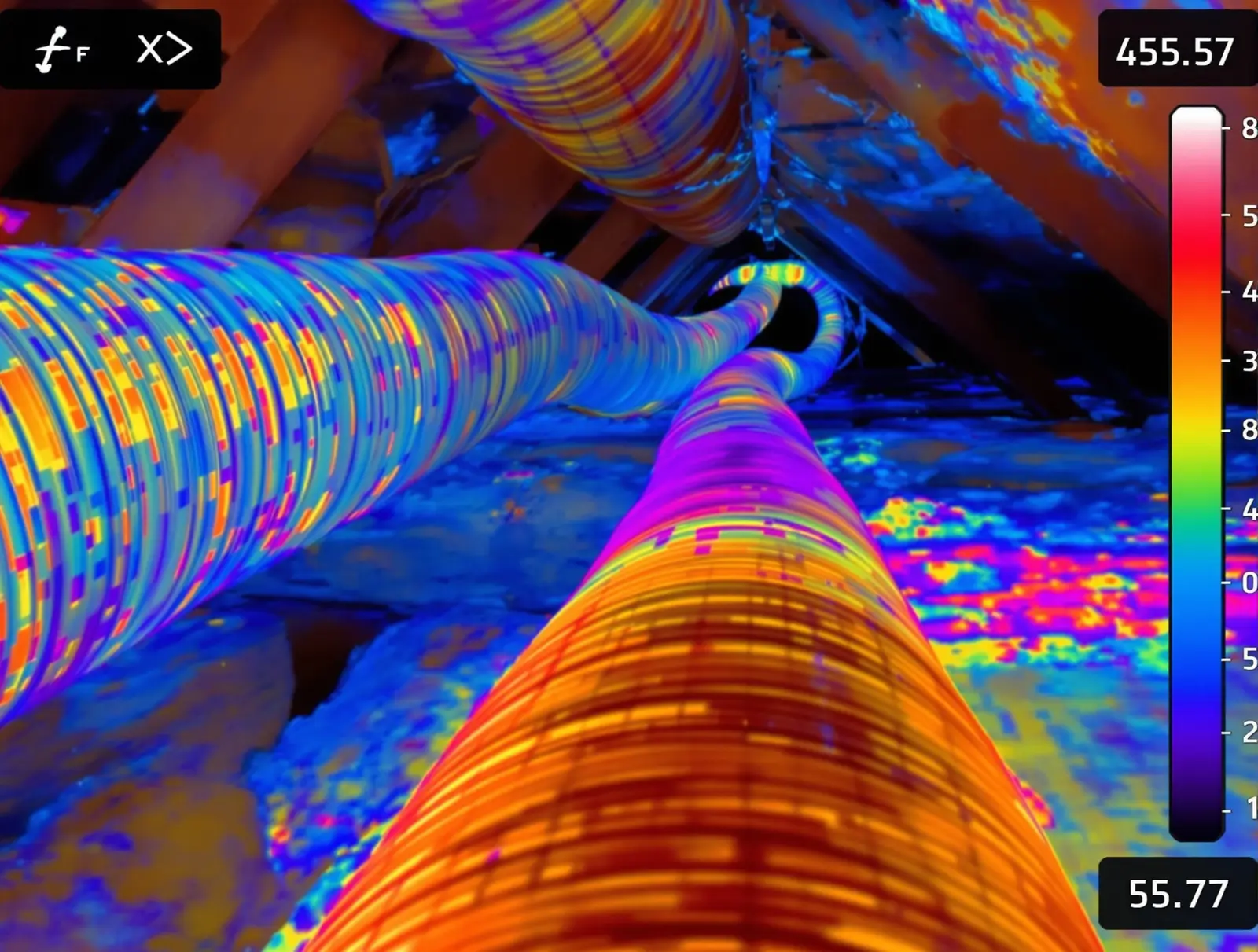 Thermal infrared image showing heat being absorbed by ductwork running through a hot attic